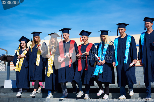 Image of young graduates students group