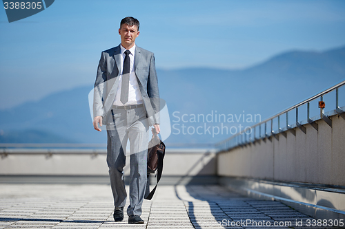 Image of senior  businessman outdoors