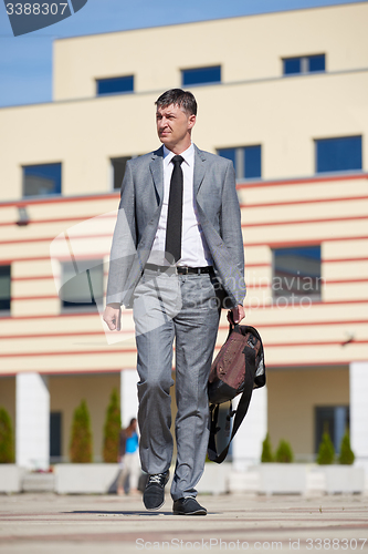 Image of senior  businessman outdoors
