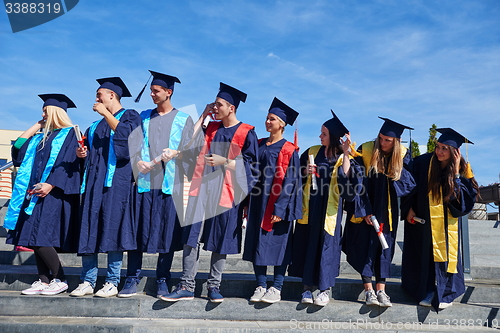 Image of young graduates students group