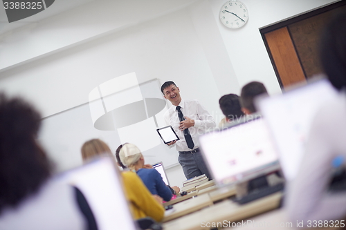 Image of students with teacher  in computer lab classrom