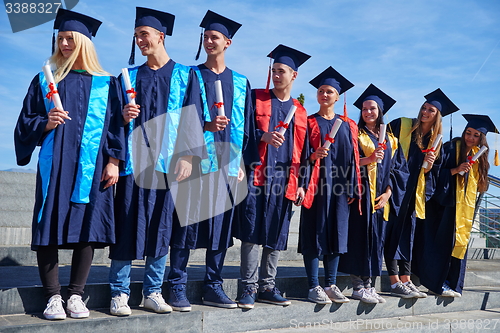 Image of young graduates students group