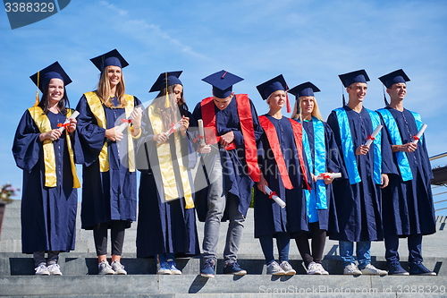 Image of young graduates students group