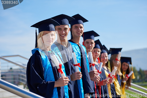 Image of young graduates students group