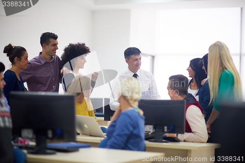 Image of students with teacher  in computer lab classrom