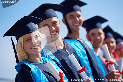 Image of young graduates students group