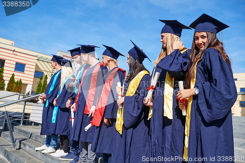 Image of young graduates students group