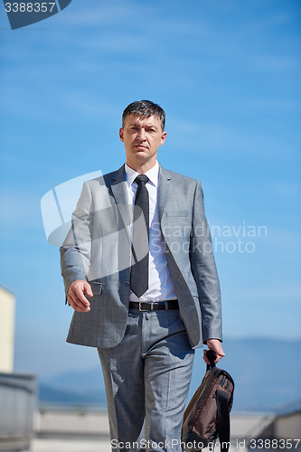 Image of senior  businessman outdoors