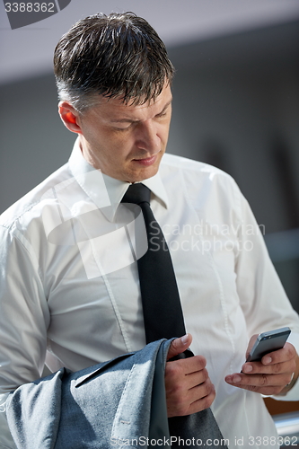 Image of business man using phone