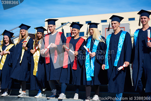 Image of young graduates students group