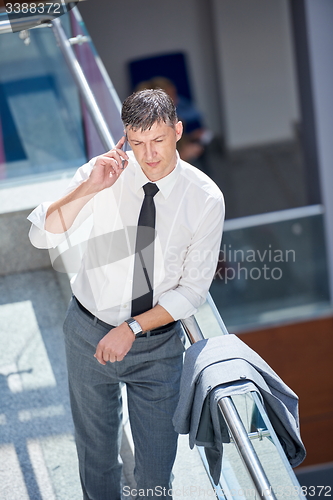 Image of business man using phone