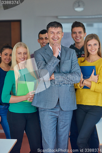 Image of group portrait of teacher with students