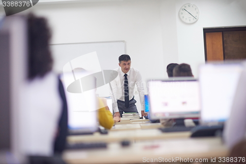 Image of students with teacher  in computer lab classrom