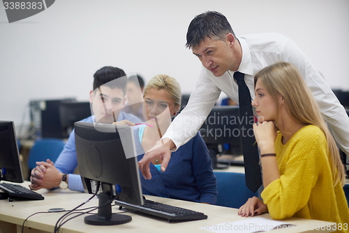 Image of students with teacher  in computer lab classrom