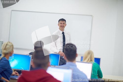Image of students with teacher  in computer lab classrom