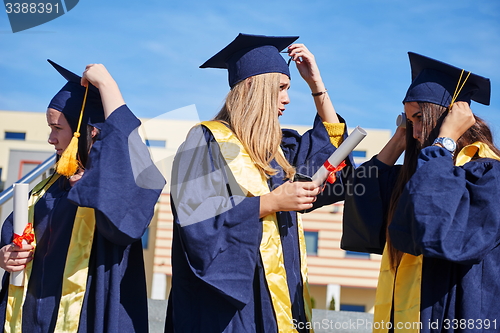 Image of young graduates students group