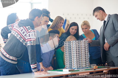 Image of group of students with teacher on class