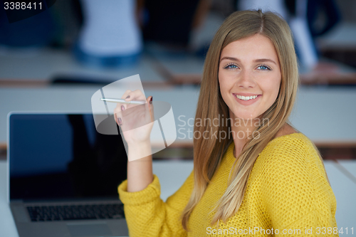 Image of portrait of happy smilling student girl at tech classroom