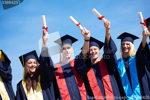 Image of young graduates students group