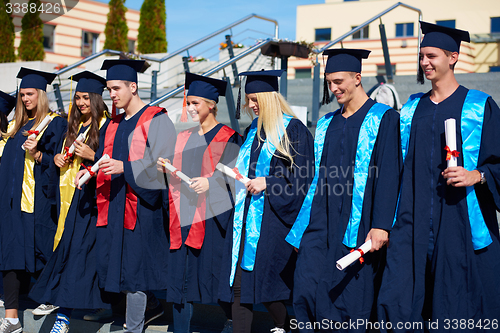 Image of young graduates students group