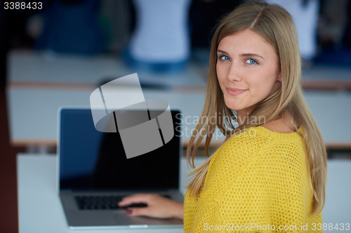 Image of portrait of happy smilling student girl at tech classroom