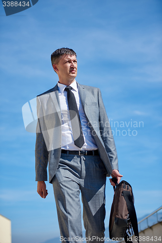 Image of senior  businessman outdoors