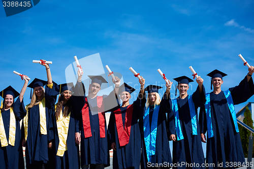 Image of young graduates students group