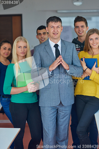 Image of group portrait of teacher with students