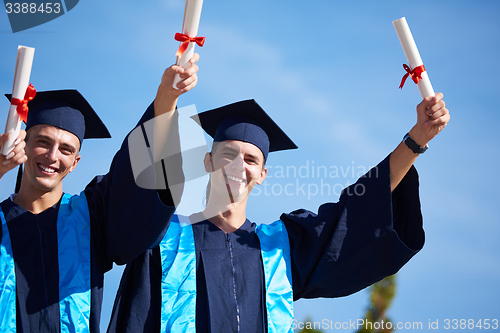 Image of young graduates students group