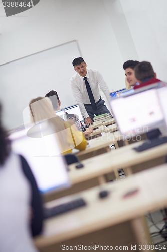 Image of students with teacher  in computer lab classrom