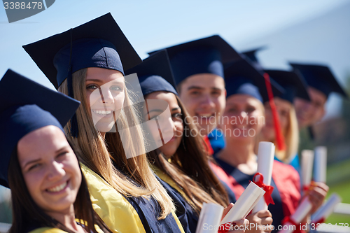 Image of young graduates students group