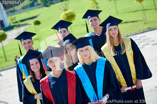 Image of young graduates students group