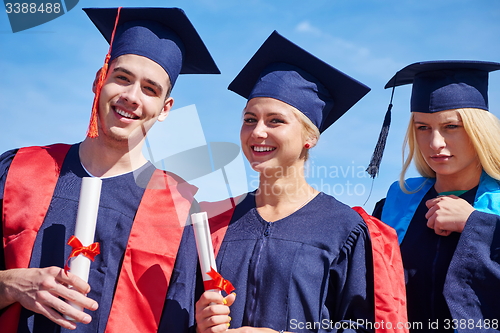 Image of young graduates students group