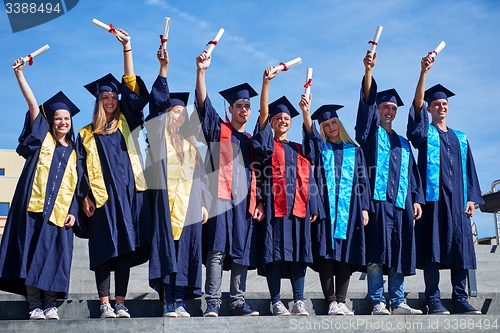 Image of young graduates students group