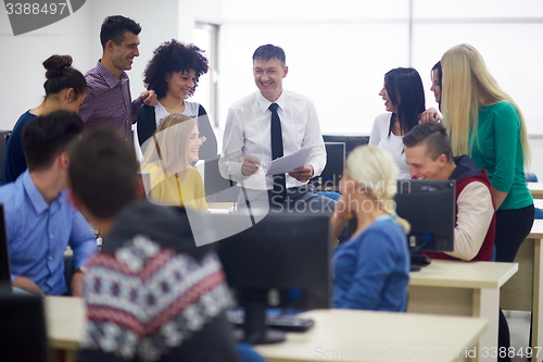 Image of students with teacher  in computer lab classrom