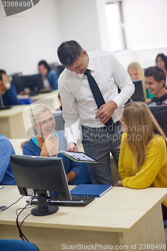 Image of students with teacher  in computer lab classrom