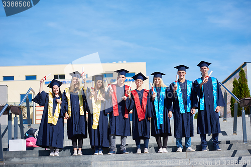 Image of young graduates students group