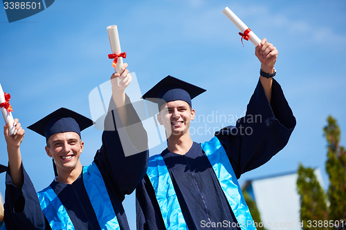 Image of young graduates students group