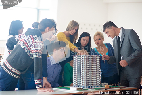 Image of group of students with teacher on class