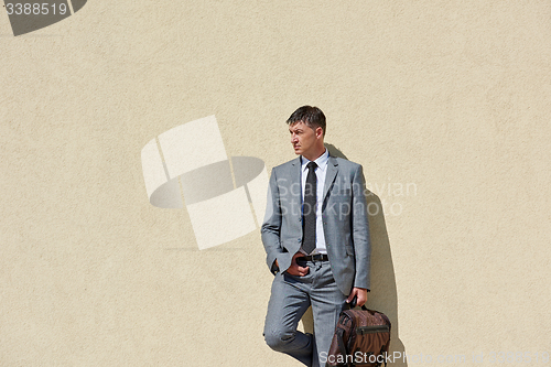 Image of senior  businessman outdoors