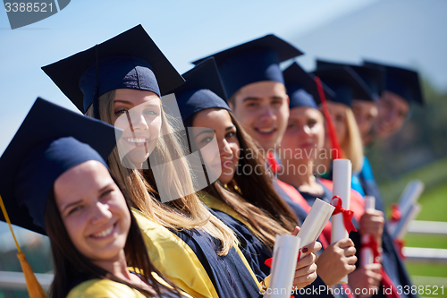 Image of young graduates students group