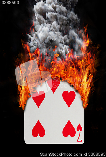 Image of Playing card with fire and smoke