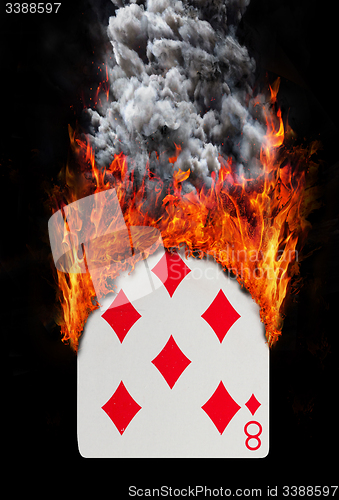 Image of Playing card with fire and smoke