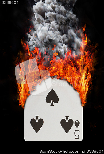 Image of Playing card with fire and smoke