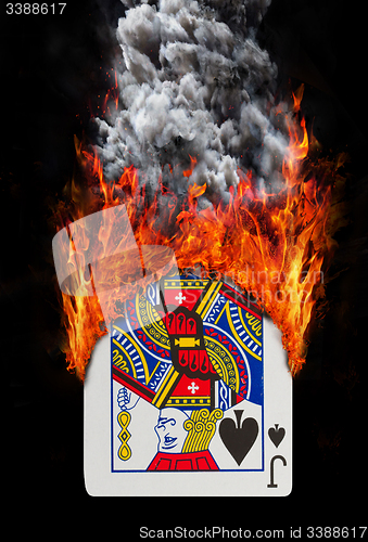 Image of Playing card with fire and smoke