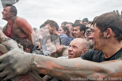 Image of Teams storm wall in extrim race. Steel Character