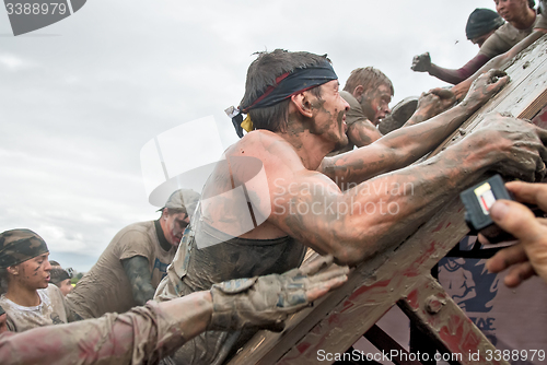 Image of Teams storm wall in extrim race. Steel Character