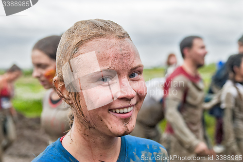 Image of Happy dirty girl in extrime racing process
