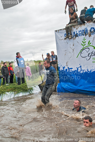 Image of Sportsmen jumps in water. Steel Character. Tyumen