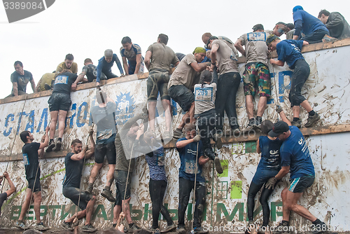 Image of Team storms big wall in extrim race. Tyumen.Russia